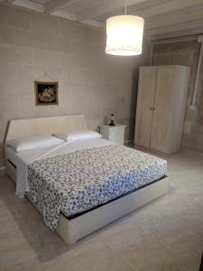 a bedroom with a large bed in a room at B&B La Casetta in Cavallino di Lecce