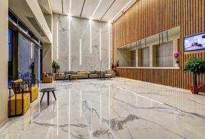 a lobby with a marble floor in a building at White Olive Elite Laganas in Laganas
