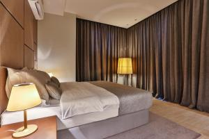 Postel nebo postele na pokoji v ubytování Avanti Hotel & Spa