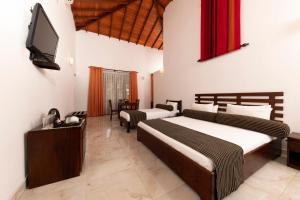 Ένα ή περισσότερα κρεβάτια σε δωμάτιο στο Melheim Kandy Villas +59 φωτογραφίες