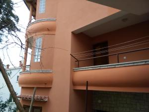 a building with balconies on the side of it at Apartments villa MaVeRo in Banjole