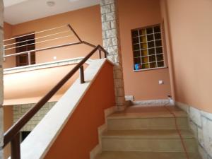 a staircase in a home with orange walls at Apartments villa MaVeRo in Banjole