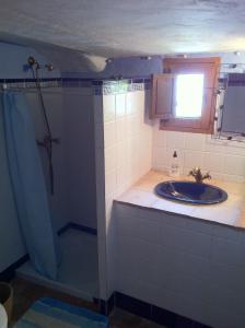a bathroom with a sink and a shower at La Casa de Corruco in Casabermeja +59 photos
