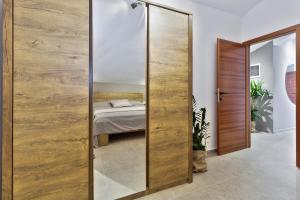 Postel nebo postele na pokoji v ubytování Apartments Vera