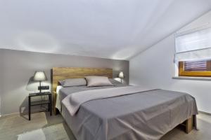 Postel nebo postele na pokoji v ubytování Apartments Vera