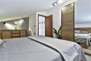 Postel nebo postele na pokoji v ubytování Apartments Vera