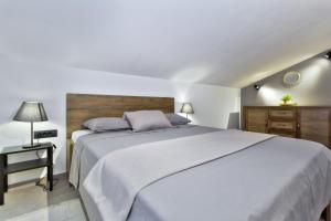 Postel nebo postele na pokoji v ubytování Apartments Vera