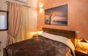 Postel nebo postele na pokoji v ubytování Villa Irene Syros