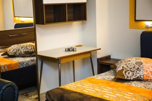 Ένα ή περισσότερα κρεβάτια σε δωμάτιο στο Apartament Calea Bucuresti