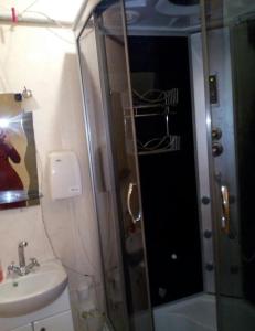 a bathroom with a sink and a toilet and a shower at квартира біля лікарні мечнікова in Dnipro