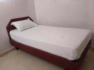 Postel nebo postele na pokoji v ubytování Anandan Tourist Home