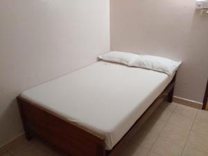 Postel nebo postele na pokoji v ubytování Anandan Tourist Home
