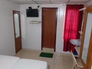Postel nebo postele na pokoji v ubytování Anandan Tourist Home