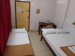 Postel nebo postele na pokoji v ubytování Anandan Tourist Home