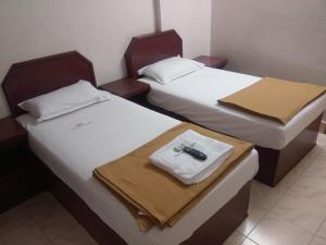 Postel nebo postele na pokoji v ubytování Anandan Tourist Home