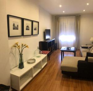a living room with a couch and a table at LA VICTORIA 1 El Paseo in Archidona