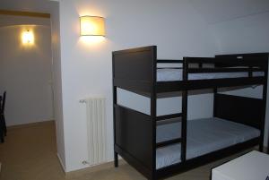 a room with two bunk beds and a lamp at Il Purgatorio in Barletta
