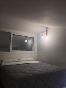 Postel nebo postele na pokoji v ubytování MILOS HOUSE