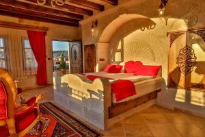 A bed or beds in a room at Cappadocia Inn Cave Hotel