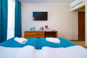 Postel nebo postele na pokoji v ubytování Pod Wzgórzem Bed & Breakfast