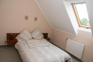 Postel nebo postele na pokoji v ubytování Apartamenty Fala