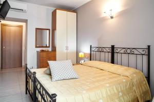 a bedroom with a large bed with a black frame at Antico Borgo in Bergamo