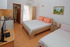 Postel nebo postele na pokoji v ubytování Apartments Ajla