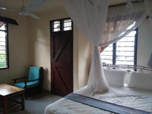 מיטה או מיטות בחדר ב-Cingaki Hotel
