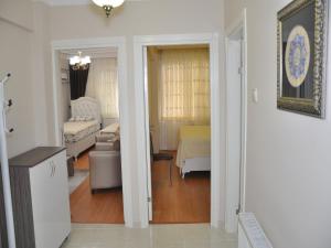 a hallway with a living room and a room with a bed at Sultanahmet Deluxe Yilmaz Apart in Istanbul +62 photos
