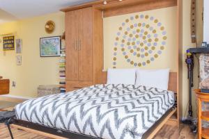 a bedroom with a zebra print bed in a room at Brighton #107 - 1 Bath Studio Apartment in Alyeska in Girdwood