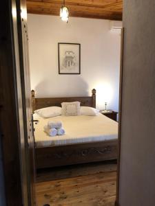 Postel nebo postele na pokoji v ubytování Hotel Gjirokastra