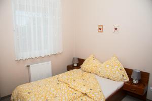 Postel nebo postele na pokoji v ubytování Apartamenty Fala