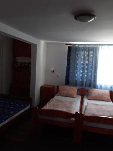 Postel nebo postele na pokoji v ubytování Molnár Vendeghaz