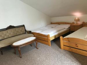 Un pat sau paturi într-o cameră la Pension Iva