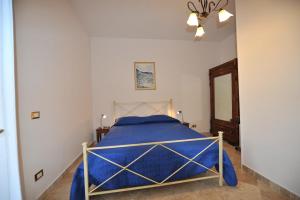 Łóżko lub łóżka w pokoju w obiekcie Gli Olivi
