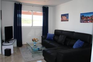 Posezení v ubytování Penthouse Charming Nueva Alcaidesa