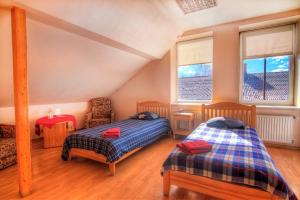 מיטה או מיטות בחדר ב-Hotel Luiize