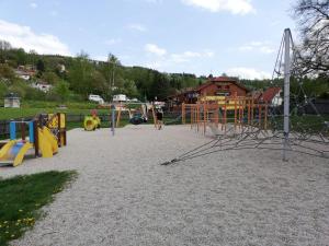 a park with a playground with play equipment at Villa Oliva in Český Krumlov
