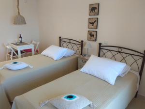 Postel nebo postele na pokoji v ubytování Sunsise Beauty by Zavolas Family - Limni Z3