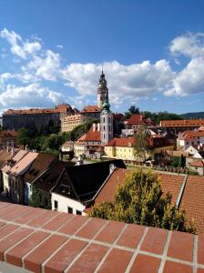 a view of a city with a clock tower at Villa Oliva in Český Krumlov