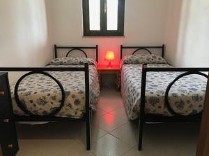 Ένα ή περισσότερα κρεβάτια σε δωμάτιο στο Villa Barabarca