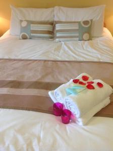 Letto o letti in una camera di Abbey Hotel
