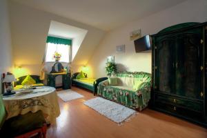 a living room with a couch and a dresser at Pensjonat U Bogusi in Berezka