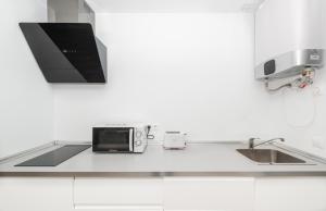 Kuchyňa alebo kuchynka v ubytovaní Fantásticos Lofts Malagueta