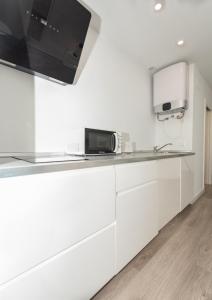 Kuchyňa alebo kuchynka v ubytovaní Fantásticos Lofts Malagueta