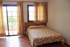 Posteľ alebo postele v izbe v ubytovaní Apartamentos Atlantis + 27 fotografií