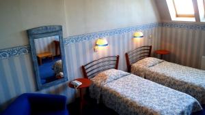 Postel nebo postele na pokoji v ubytování Hotel Marmułowski