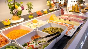 
a variety of food is displayed in a kitchen at Port Vista Oro in Benidorm
