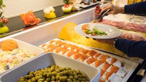 
a buffet table filled with different types of food at Port Vista Oro in Benidorm
