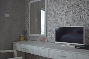 a flat screen tv sitting on top of a cabinet at Bistra Guest Rooms in Kranevo